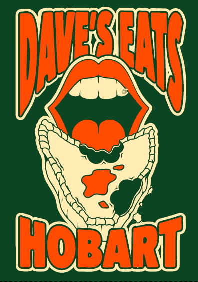 Detail of the breast logo on the Tassie-green tee